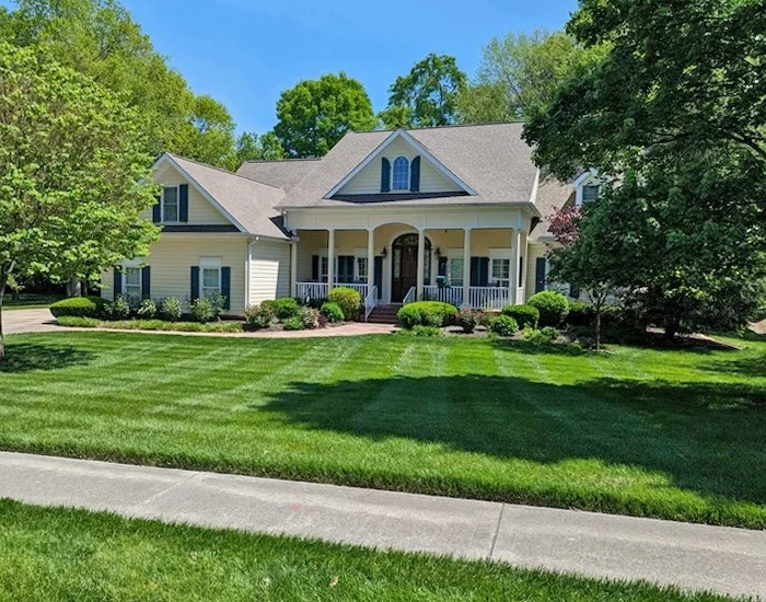 house with green lawn